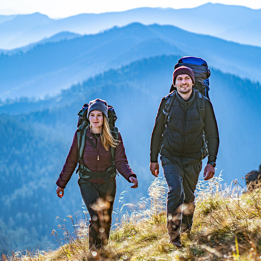 The young couple going to the mountain