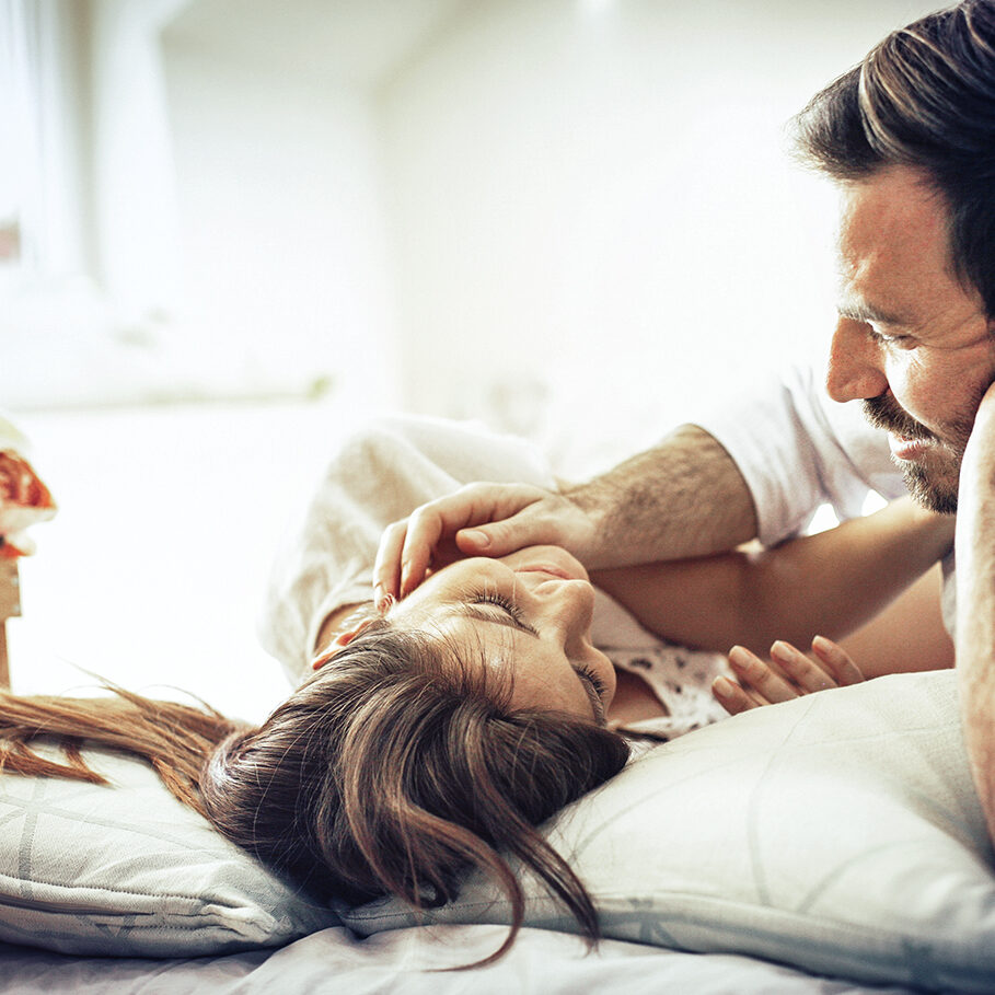 Our love will be eternal. Happy couple in bed. Space for copy.