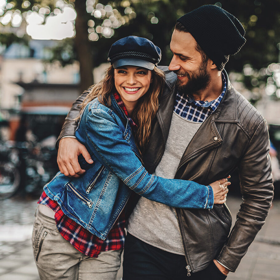 Close up of a happy young couple enjoying city life.