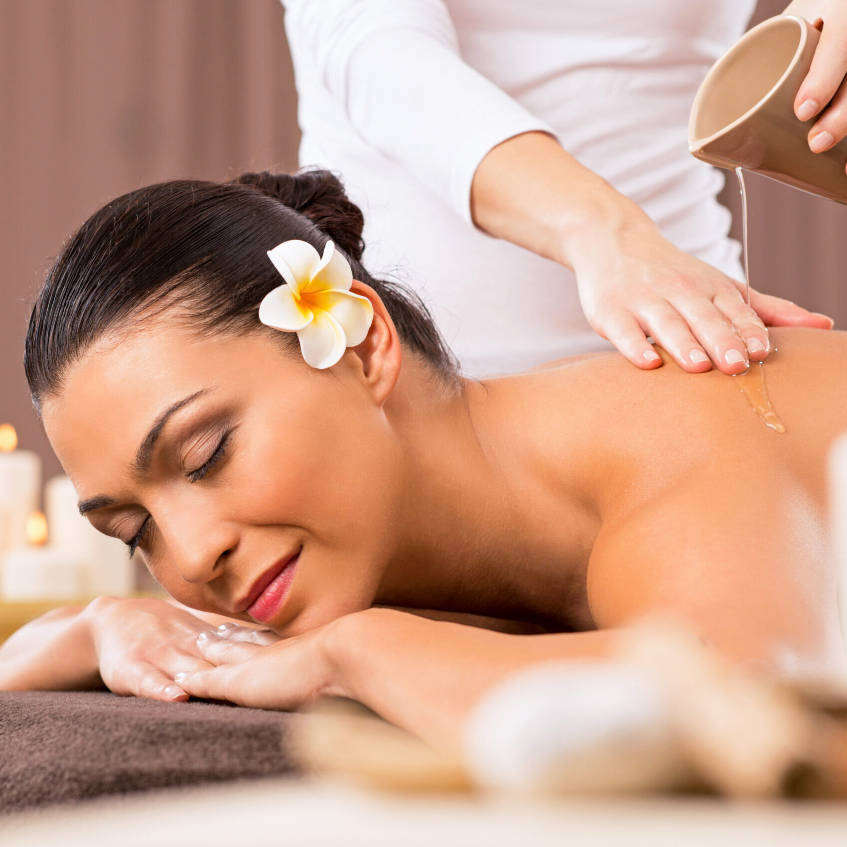 Relaxed Woman Receiving A Back Massage At Health Spa