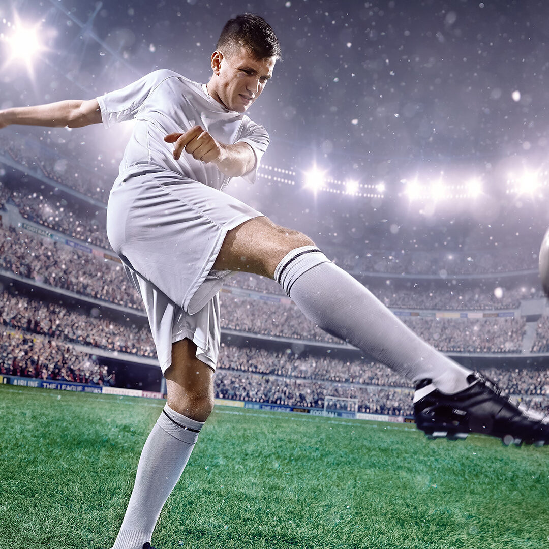 Soccer player in action on a professional arena full of spectators. Sport stadium made in 3D