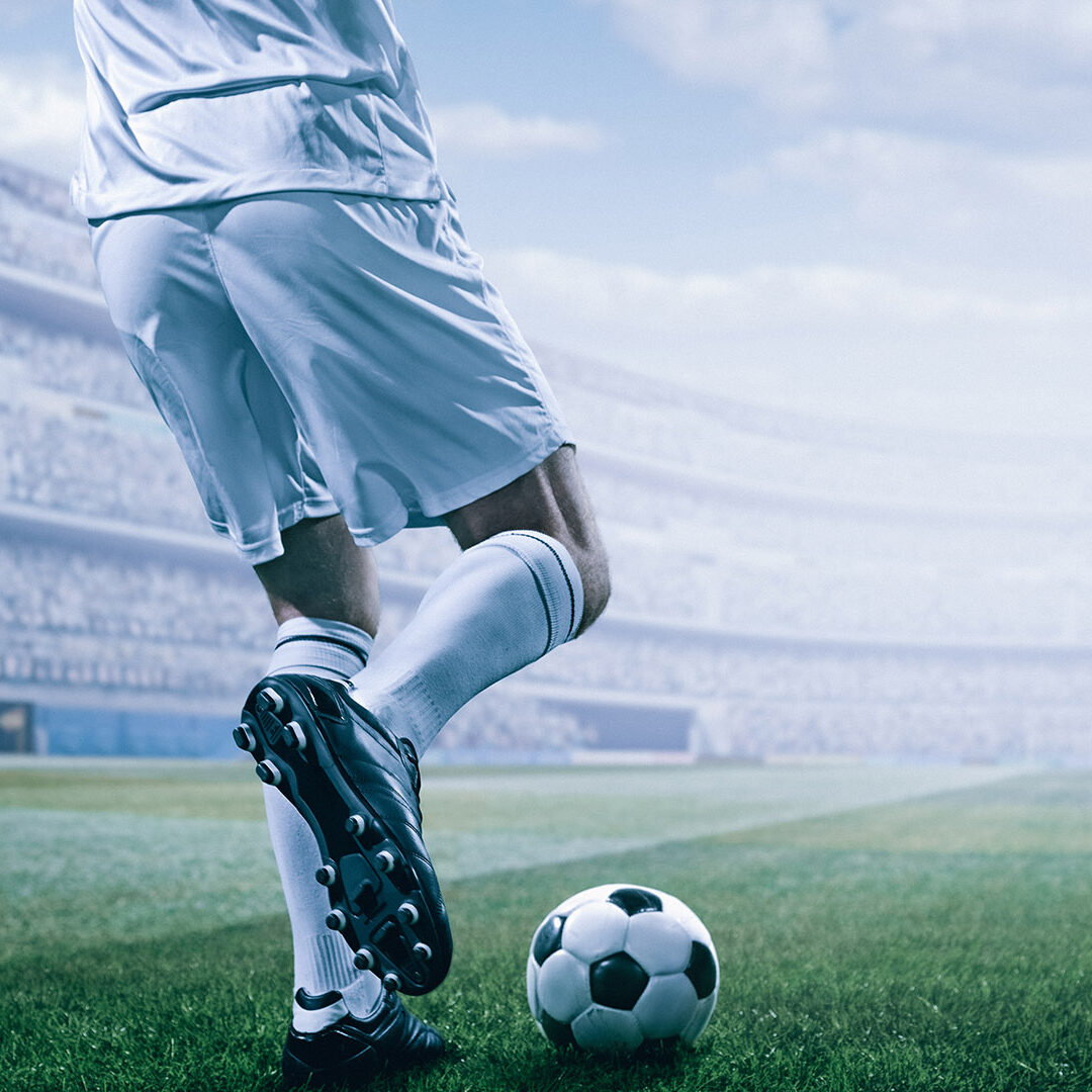 Soccer player in action on a professional arena full of spectators. Sport stadium made in 3D