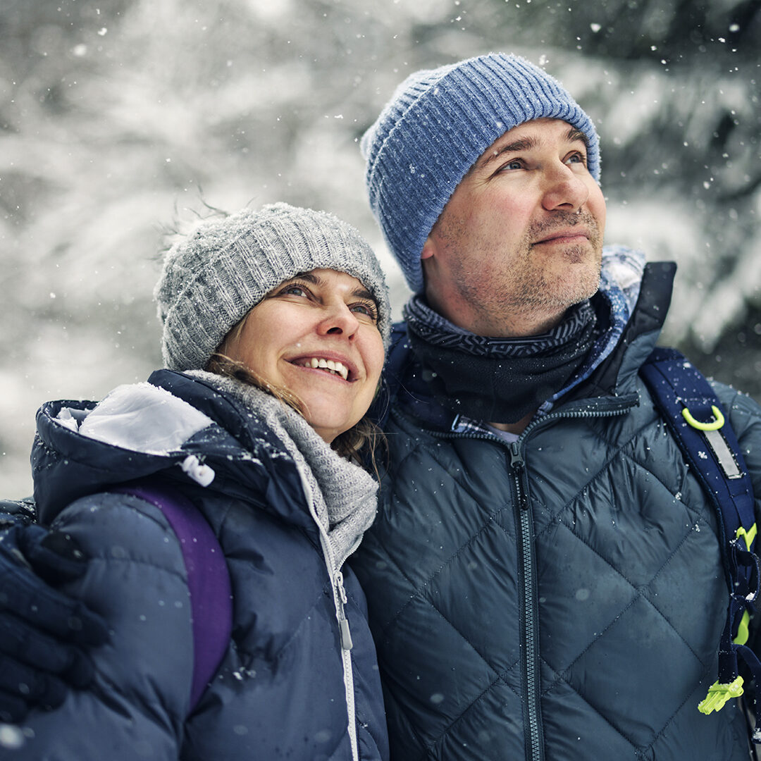 Portrait of middle aged couple hiking in beautiful European Alps mountains on an overcast  winter day
Shot with Canon R5